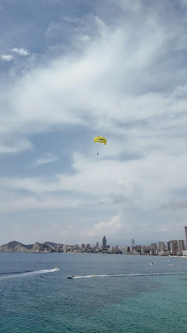 Parasailing Over Coastal City