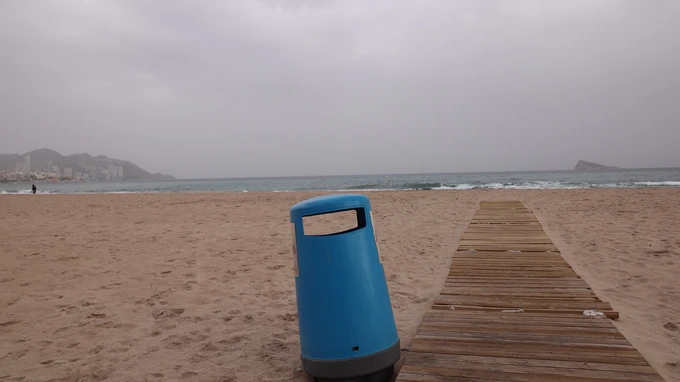 Beachside Serenity with a Blue Bin