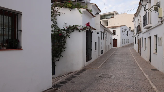 Quaint Alleyway in Whitewashed Village