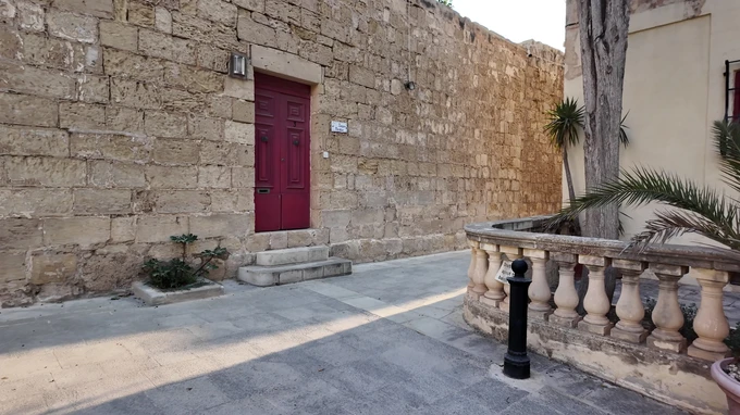 Historic Stone Wall with Red Door