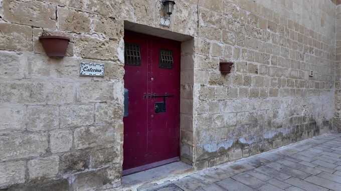 Historic Stone Wall with Red Door