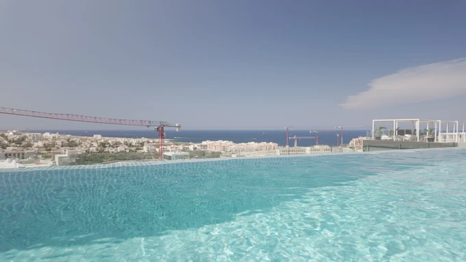 Infinity Pool Overlooking Coastal Cityscape