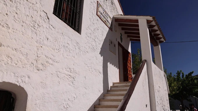 Rustic White Building with Staircase