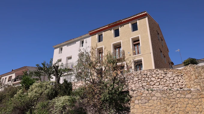Hillside Buildings with Stone Wall