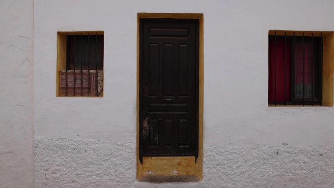 Rustic Doorway in White Wall