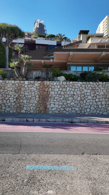 Modern Building by a Stone Wall