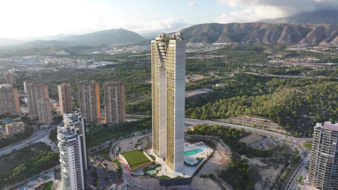 Tall Skyscraper Amidst Landscape