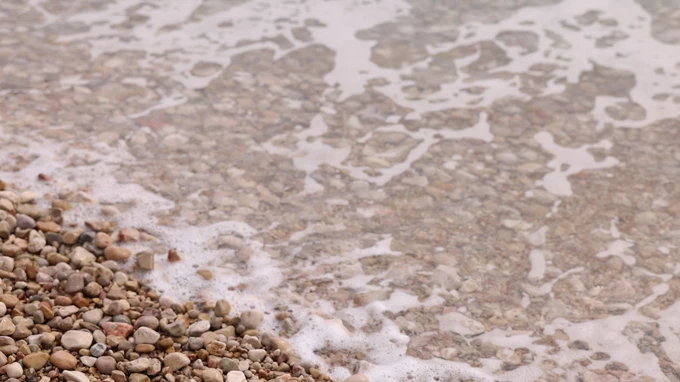 Pebble Beach with Gentle Waves